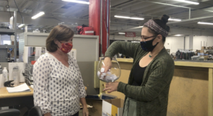 LPC Human Resource Manager, Merry Hawley and Executive Assistant, Kim Baker are shown doing the grand prize drawing for one nominee to win a paid day off.