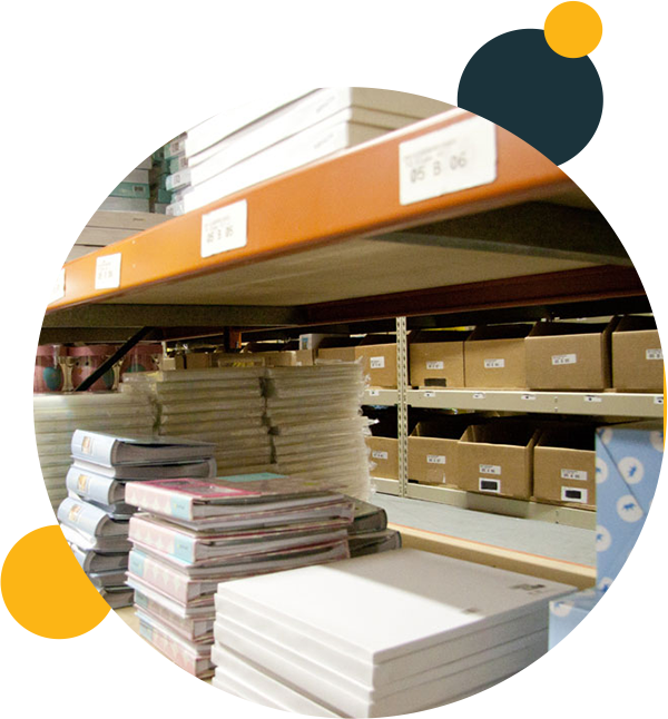 Stacked papers on a shelf, ready to be shipped